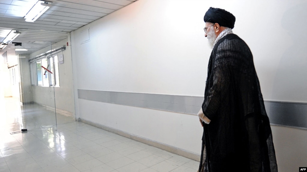 Iran -- Iran's supreme leader, Ayatollah Ali Khamenei, walks down the corridor of a hospital after being discharged in Tehran, September 15, 2014
