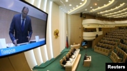 Russian Foreign Minister Sergei Lavrov addressed members of the Federation Council, Russia's upper house of parliament, ahead of their ratification in Moscow on March 21 of the annexation of the Ukraine's republic of Crimea.