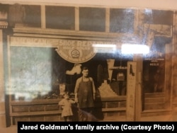 Harry Goldman, Jared’s great-grandfather, in front of his shoe shop with his gandson
