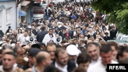 Opposition supporters march from Boris Paichadze Stadium to the Sameba cathedral in the Georgian capital on May 26.