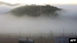 An Israeli patrol along Israel's border with Syria, as seen from the Druze village of Majdal Shams today