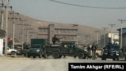 Afghan security forces surrounded the site of a suicide bombing attack in Kabul on March 17.