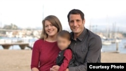 An undated photo of Ryan Smith, his wife, Laura, and their young son. 