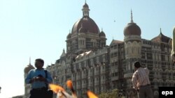 Candles stand outside the Taj Mahal Hotel on December 2, 2008, during a vigil in memory of victims killed by the attacks in Mumbai.