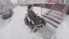 Andrei Vinogradov, a Russian disability activist in Tomsk, shows a building without wheelchair access. 