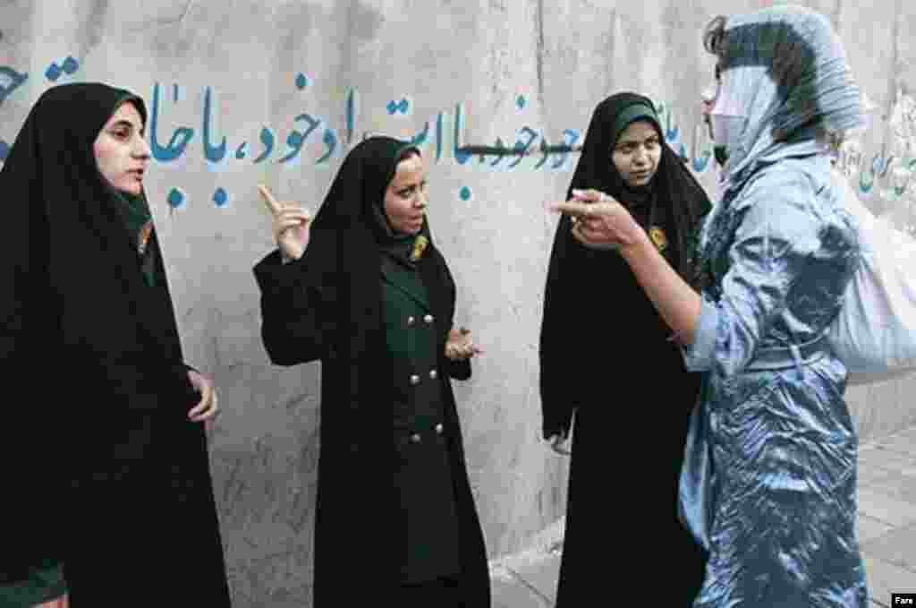 Police and Basij activists check women for proper dress in Tehran on April 22 (Fars) - Ahmadi-Moqaddam said 13 detained women have been handed over to judiciary officials. He told reporters the police campaign is not just aimed at making women wear their scarves conservatively, but at enhancing public security for women and their families.