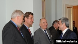 Armenian President Serzh Sarkisian (right) shakes hands with Matthew Bryza, with fellow Minsk co-Chairs Bernard Facier and Yury Merzlyakov in Yerevan.