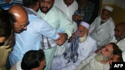 Relatives mourn the killing of Fakhrul Islam, 46, who was a candidate for the secular Muttahida Qaumi Movement (MQM), following the attack in the southern city of Hyderabad on April 11.