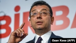 TURKEY -- Turkey's main opposition party CHP candidate Ekrem Imamoglu, who claimed victory as Istanbul mayor, gestures as he speaks during a press conference at the CHP's Election Coordination Centre in Istanbul, April 3, 2019