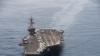 An aerial handout imge made available by US Navy showing the aircraft carrier USS Theodore Roosevelt operating in the Arabian Sea on 21 April 2015 conducting maritime security operations. 