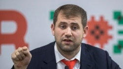 Ilan Shor speaks at an election campaign briefing at his party's headquarters in Chisinau on February 22, 2019.