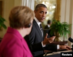 U.S. President Barack Obama and German Chancellor Angela Merkel at the White House on February 9.
