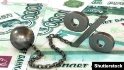 Generic – 3d illustration: rust iron ball and chain with the cuff hanging percent symbol on roubles banknotes background. The business concept of debt with a high interest rate. The stress of mortgage.