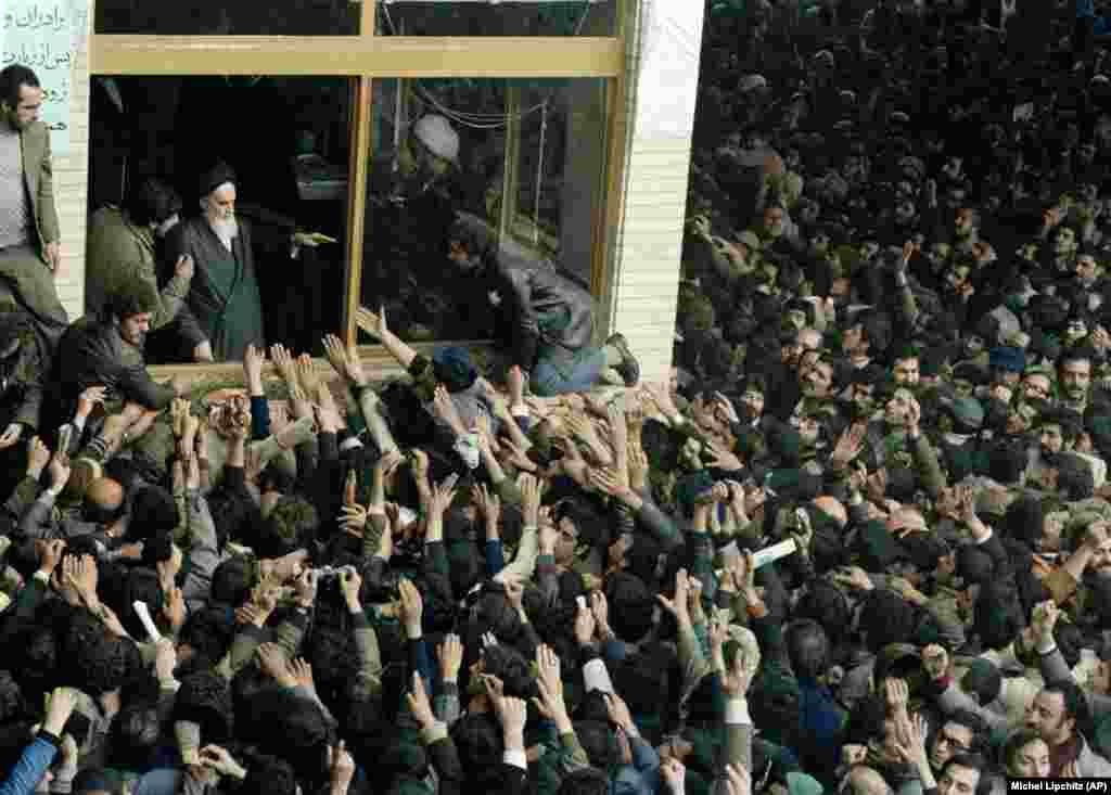 Khomeini with his son, Ahmad, addressing crowds on February 4, 1979.&nbsp;