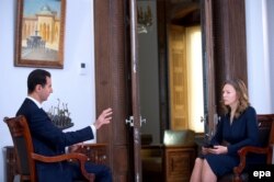 Președintele sirian Bashar al-Assad, intervievat de Maria Finoshina de la postul TV Russia Today, Damasc, 14 decembrie 2016