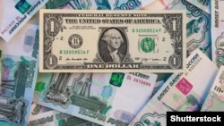 Russia – One American dollar on the background of Russian roubles 1000 bills