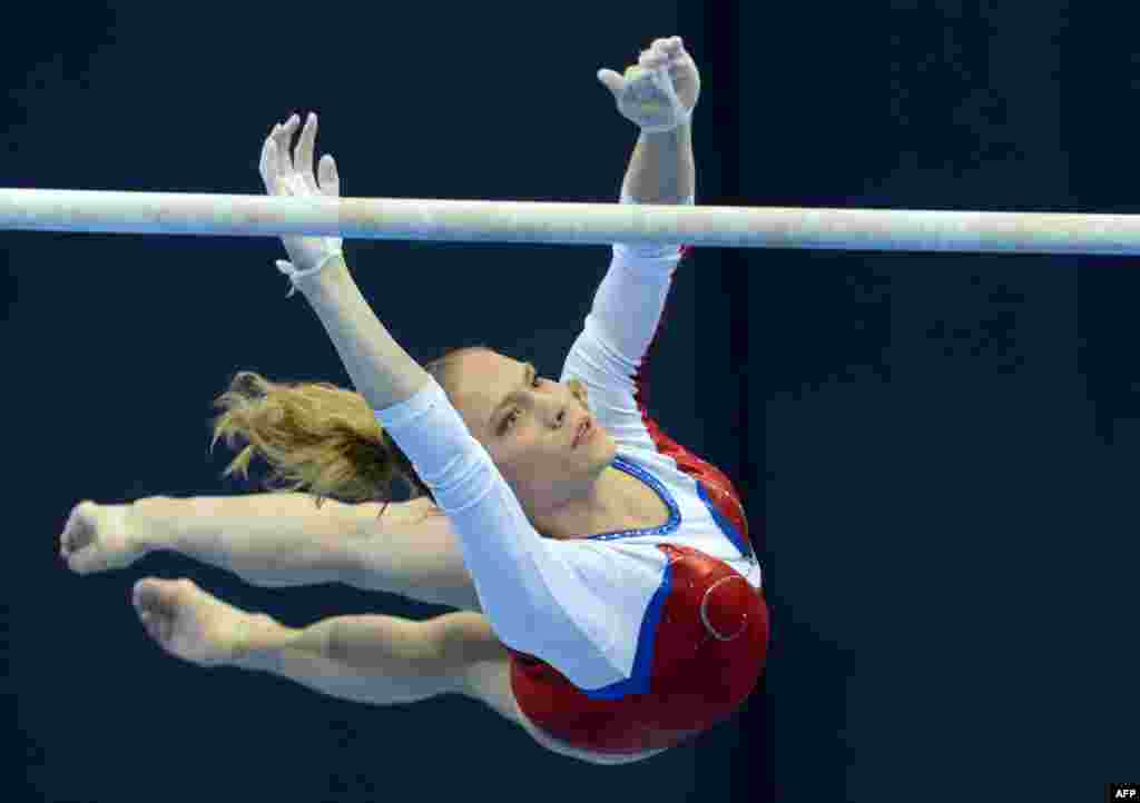 Russia&#39;s Kseniia Afanaseva competes on the uneven bars in the women&#39;s individual artistic gymnastics qualification during the fifth European Men&#39;s and Women&#39;s Artistic Gymnastic Individual Championships in Moscow on April 18. (AFP/Natalia Kolesnikova)