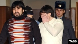 Three Chechen men, Magomed Dukuzov's brother Kazbek (left), Musa Vakhayev (right), and Fail Sadretdinov (behind), were acquitted of the killing in May 2006.