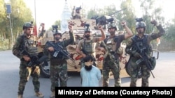 Afghan soldiers surround a captured Islamic State fighter in eastern Afghanistan on August 5.