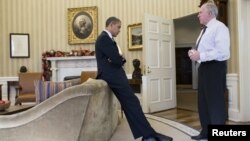 Претседателот Барак Обама и директорот на ЦИА Џон Бренан.