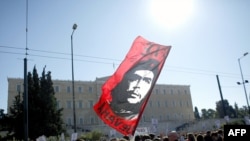 Demonstrators congregate in front of the Greek parliament in Athens.