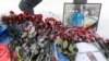 Red carnations are placed near a portrait of a Russian pilot Roman Filipov, who was shot down in Syria, in front of the Russian Defense Ministry in Moscow, Russia, 06 February 2018.