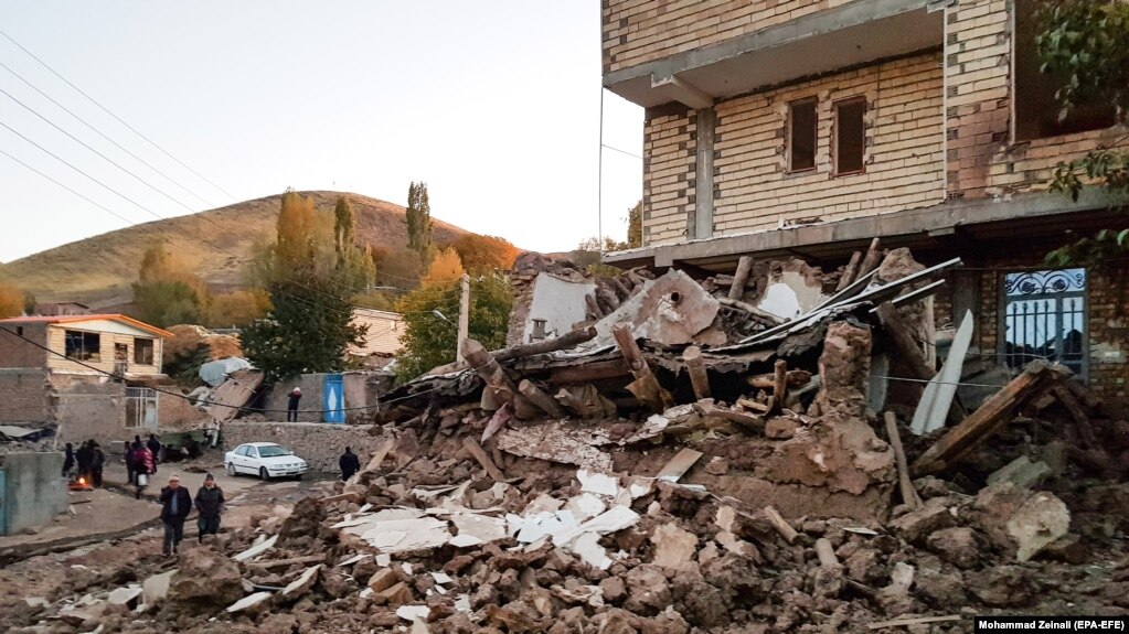 Buildings lie damaged in a village in Iran's East Azerbaijan Province following an earthquake on November 8. 