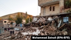 Buildings lie damaged in a village in Iran's East Azerbaijan Province following an earthquake on November 8.