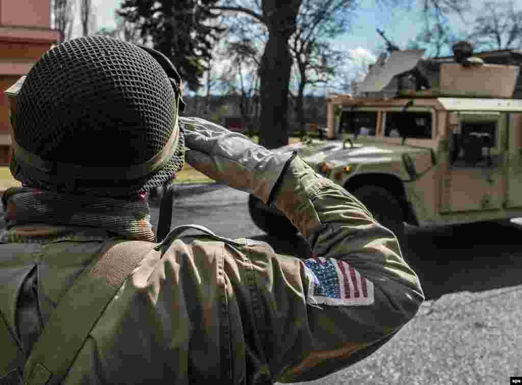 A supporter wears a World War II-style U.S. Army uniform.