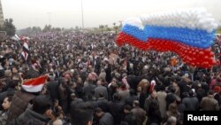 Assad supporters welcome Lavrov to Damascus.