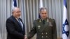 Israel's minister of defence Avigdor Lieberman (L) and Russia's minister of defence Sergei Shoigu shake hands during a meeting. TEL AVIV, OCTOBER 16, 2017