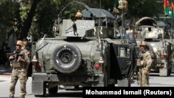 Афганские силы безопасности после теракта в Кабуле 9 мая