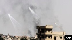 Smoke is seen following an air strike on Raqqa by U.S.-backed Syrian Democratic Forces in July.