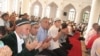 Tajikis pray in Dushanbe's central mosque during the feast of Eid al-Fitr. Islam's growing influence is showing up in the new fashion for names.