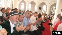 Tajikis pray in Dushanbe's central mosque during the feast of Eid al-Fitr. Islam's growing influence is showing up in the new fashion for names.