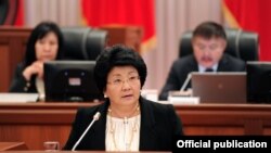 Kyrgyz President Roza Otunbaeva speaks before parliament in Bishkek on November 30.