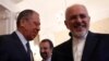 Russian Foreign Minister Sergei Lavrov (left) welcomes his Iranian counterpart, Mohammad Javad Zarif, during their meeting in Moscow on May 14. 