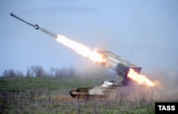 A TOS-1A Buratino multiple rocket is launched during a military drill at Prudboi training ground in the Volgograd region in 2014.
