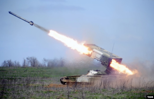 A TOS-1A Buratino multiple rocket is launched during a military drill at Prudboi training ground in the Volgograd region in 2014.