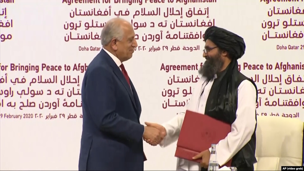 The Doha agreement between the Taliban and the United States was signed by the U.S. Special Representative for Afghanistan Reconciliation Zalmay Khalilzad (left) and Taliban leader Mullah Baradar Abdul-Ghani on February 29, 2020.