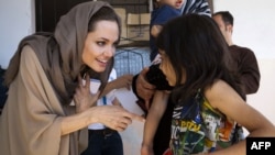 UNHCR special envoy Angelina Jolie meets with Syrian children refugees in the eastern Lebanon's Bekaa Valley near the border with Syria, 12Sep2012