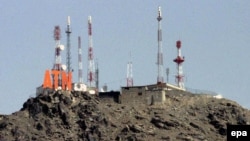 Looking higher: telecoms towers on a hilltop above Kabul