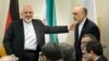 Daşary işler ministri Jawad Zarif (Ç) Eýranyň Atom energiýasy guramasynyň başlygy Ali Akbar Salehi 5+1-iň we ÝB wekilleriniň Eýran bilen duşuşygynda, Lausanne, 31-nji mart, 2015 ý.