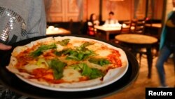 საილუსტრაციო ფოტო. იტალიური პიცა მოსკოვის ერთ-ერთ რესტორანში