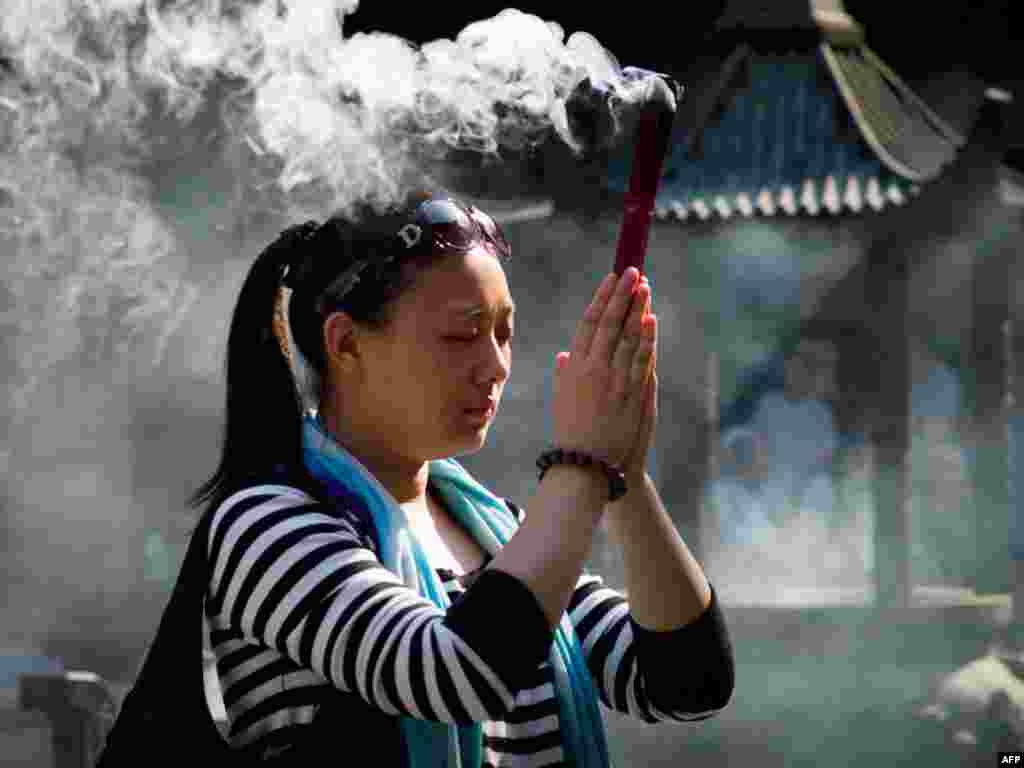 Кітай. 61-я гадавіна КНР адзначаецца “залатым тыднем” - адпачынкам, калі зьбіраюцца сем'і і наведваюцца храмы.