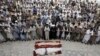 Pakistan -- Shi'ite Muslim men from the ethnic Hazara minority attend a funeral of their relatives who were killed after gunmen opened fire on a car on the outskirts of Quetta, July 19, 2017