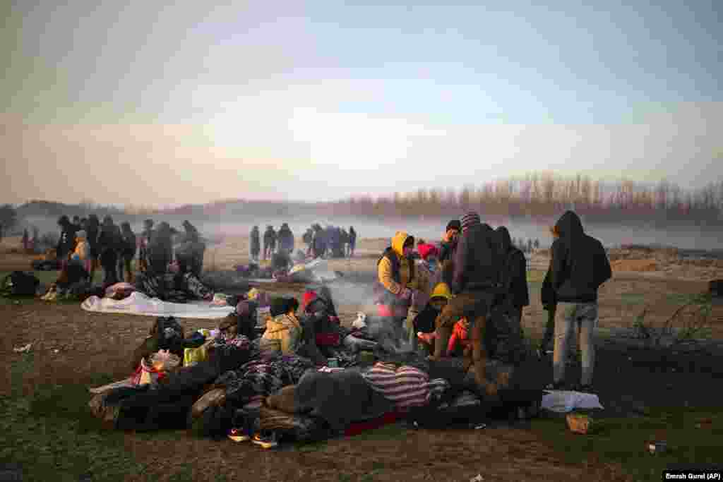 Migrants gather at Meric river near the Pazarkule border gate near Edirne, Turkey, on March 1.