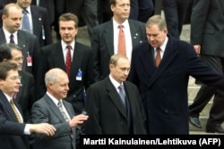 Then-Russian Prime Minister Vladimir Putin (second from right) during an EU-Russian summit in Helsinki on October 22, 1999.