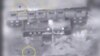 A screen grab from a video of an undated material released by the Israeli military on March 21, 2018 shows yellow circles depicting bombs during what the military describes is an Israeli air strike on a suspected Syrian nuclear reactor site near 