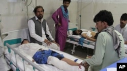 A wounded men receives treatment in a hospital after a suicide attack on the outskirts of Jalalabad on June 13.